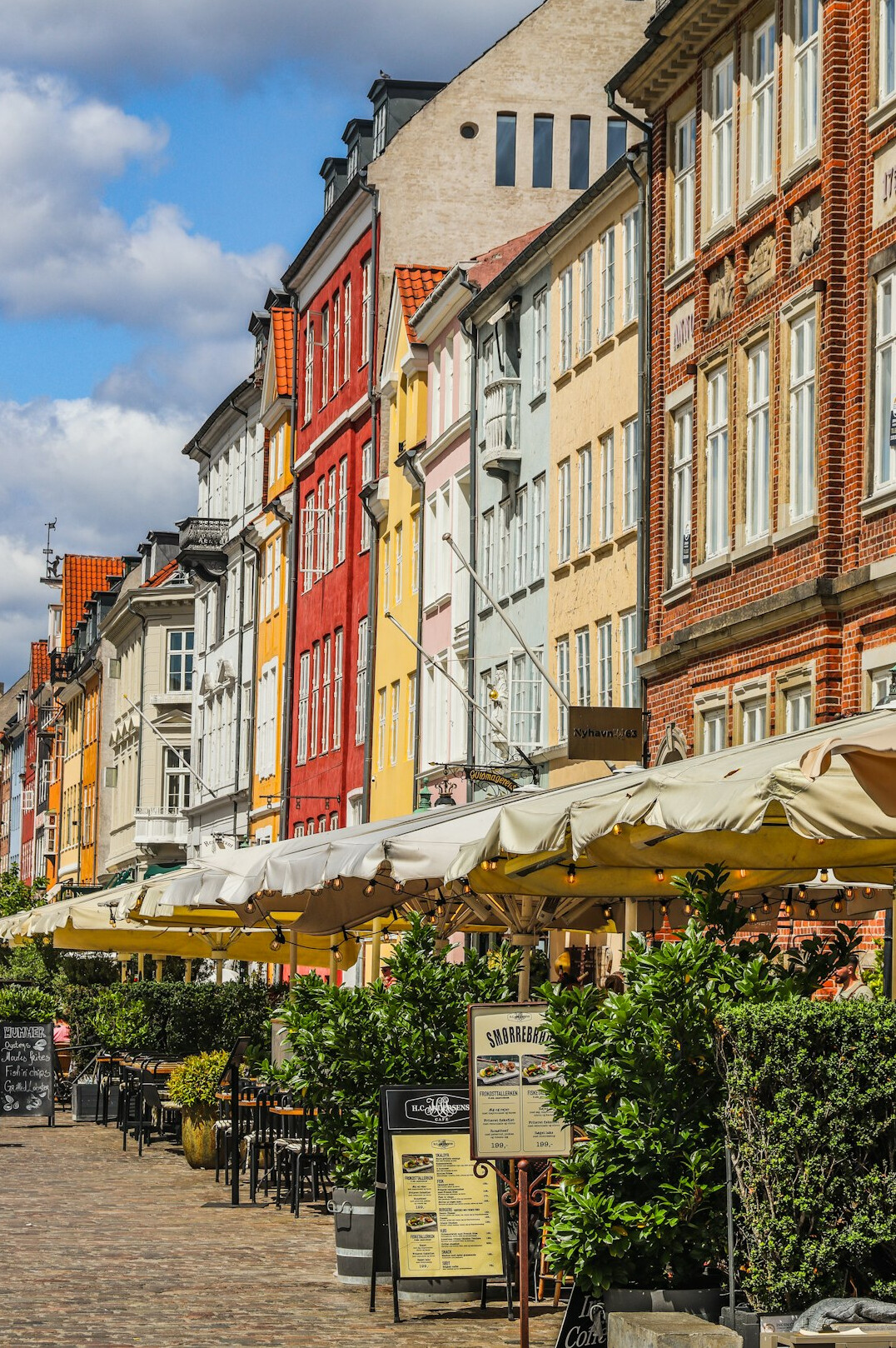 Row of bicycles parked along a cobblestone street in Copenhagen